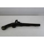 A antique flintlock pistol with brass mounts. Barrel Length 11 3/4 inches. Engraved Tower.