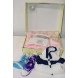 A boxed new baby blanket and a selection of baby clothes etc