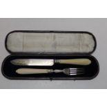 A antique cased carving set