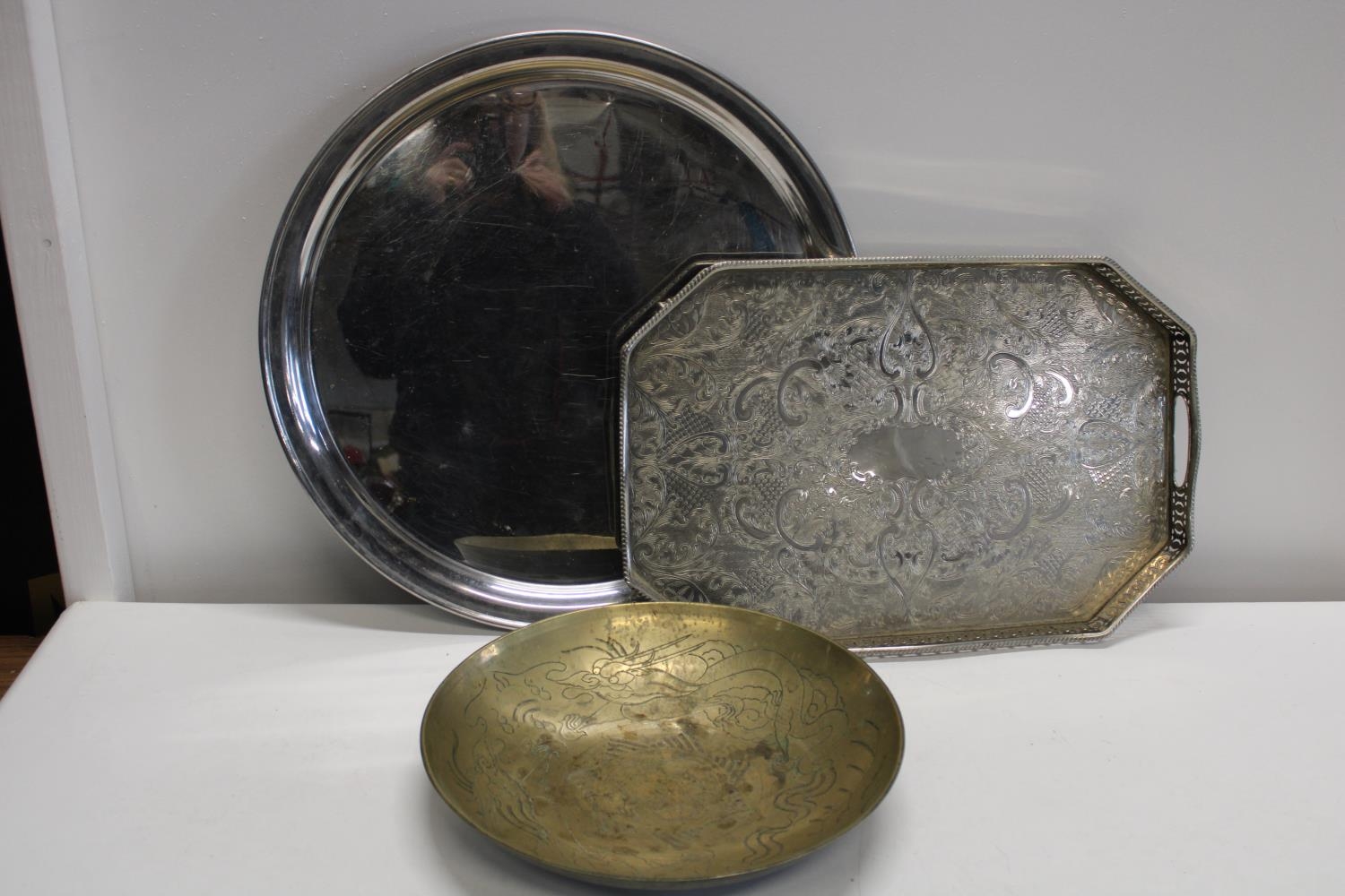 Three pieces of assorted metal ware