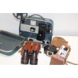 A box of assorted cameras, projector & binoculars