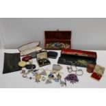 A selection of costume jewellery and cases etc