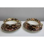 A pair of Royal Crown Derby cups & saucers (2451)