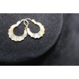 A pair of 9ct gold patterned Creole earrings