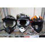 Three crash helmets