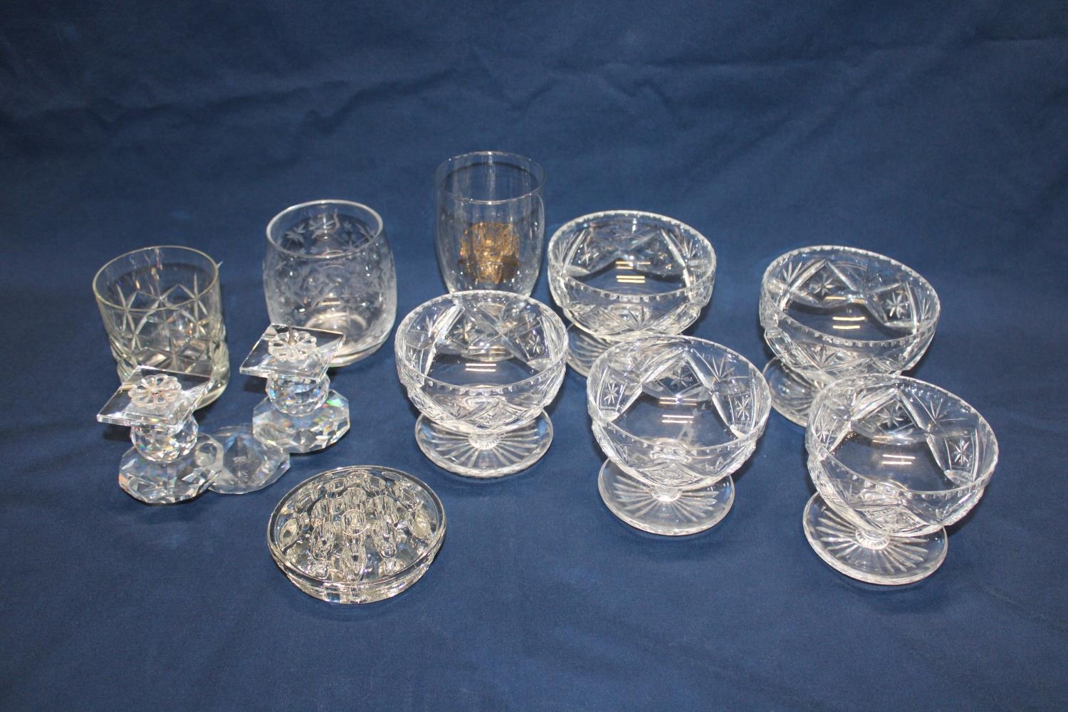 A shelf full of vintage glassware