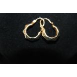 A pair of 9ct gold Creole earrings