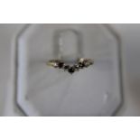 A 9ct gold sapphire wishbone ring size N 1/2