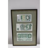 Three framed British bank notes