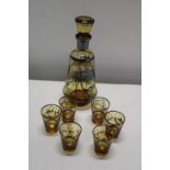 A vintage decanter & glasses set