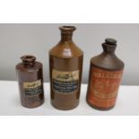 Three antique stoneware bottles - tallest 22.5cm