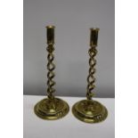 A good pair of brass twist form candlesticks - 32.2cm tall