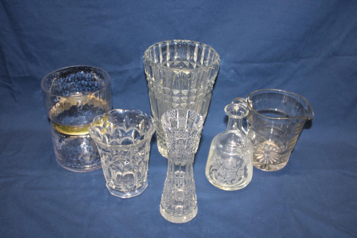 A shelf full of vintage glassware