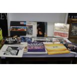 A box of various genre LP records