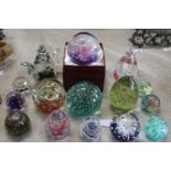 A good selection of assorted glass paperweights