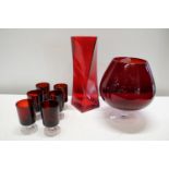 A collection of red glass ware