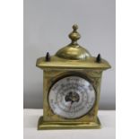 A heavy brass cased barometer 30cm height