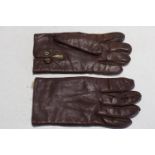 A pair of good quality leather and fur lined vintage driving gloves