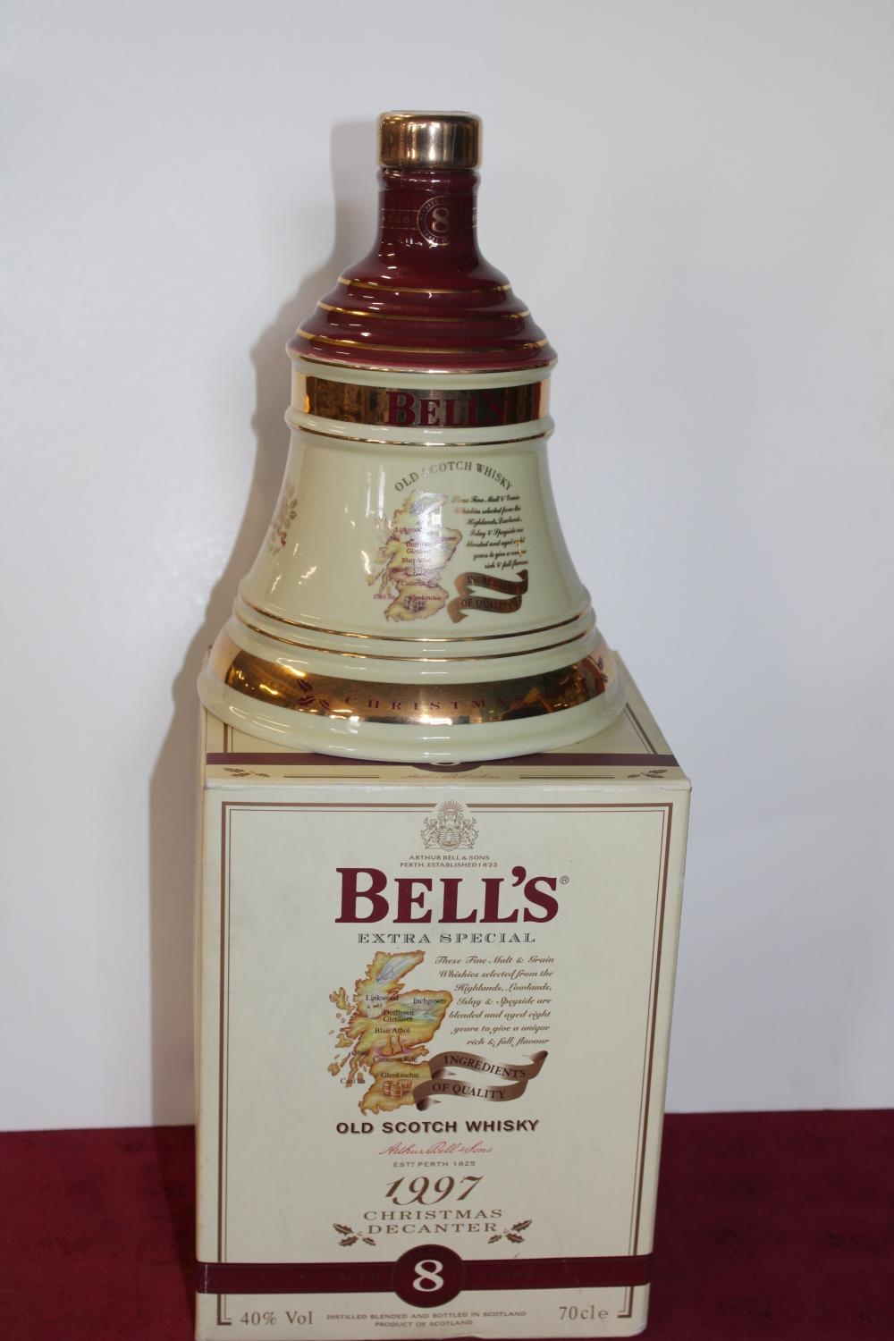 A sealed bottle of Bells Christmas whisky 1997