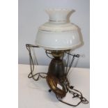 A vintage brass and glass hanging lamp