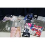 A box of assorted new clothing etc