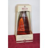 A sealed bottle of Bells 8 year old Millennium whisky
