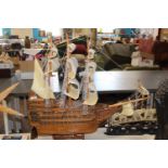 A large hand made wooden galleon length 79cm, height 73cm. Collection only