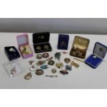 A selection of costume jewellery, brooches, cufflinks etc.