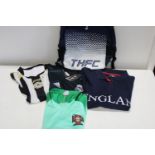 A selection of sports clothing and other one with new tags