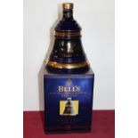 A sealed bottle of Bells whisky for the 50th birthday of Prince Charles 1998