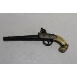 A novelty flintlock pistol with decorative handle