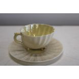 A Belek porcelain cup & saucer with green back stamp