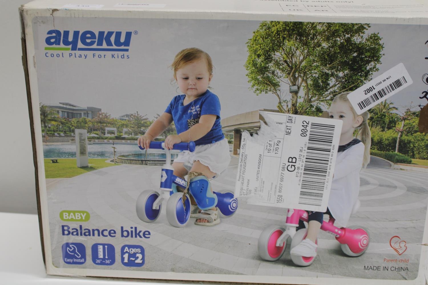 A boxed as new child's balance bike