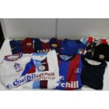A job lot of football shirts & scarves etc (sold as seen no returns)