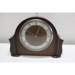 A vintage wooden mantle clock