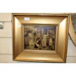 A gilt framed crystoleum of a village scene