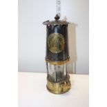 A vintage colliery miners lamp