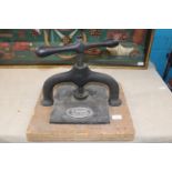 A antique cast iron book press, Postage unavailable