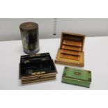 A selection of vintage tins & a wooden cigarette dispenser