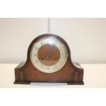 A antique wooden cased mantle clock