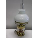 A brass & ceramic oil lamp style electric table lamp