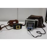 A vintage Polaroid EK2 camera & Kodak brownie
