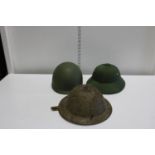 Three military style helmets