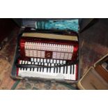 A vintage Hohner Verdi V N accordian in red in original case, Postage unavailable