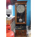 A antique factory clocking in clock made by the International Time Recording Company.