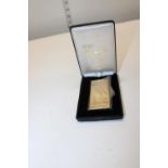 A boxed Givenchy gold plated lighter