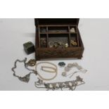 A wooden jewellery casket & contents