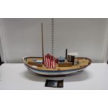 A wooden hand built boat model