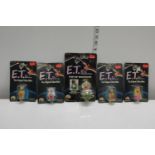 Five boxed ET related toys