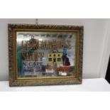 A vintage gilt framed advertising mirror